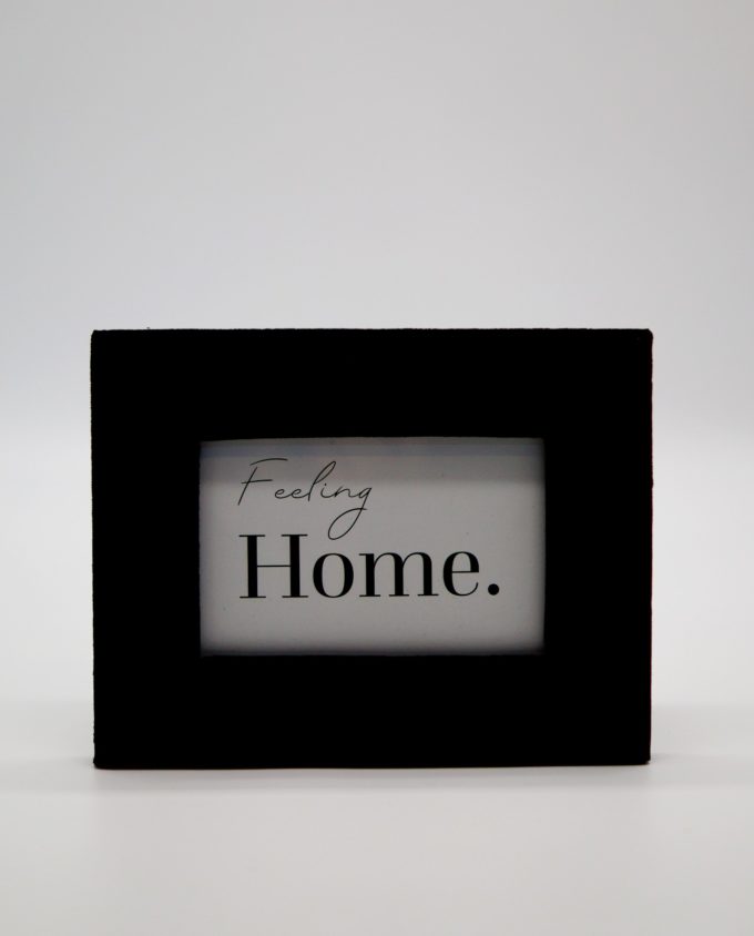 Wooden picture frame with black velvet fabric exterior