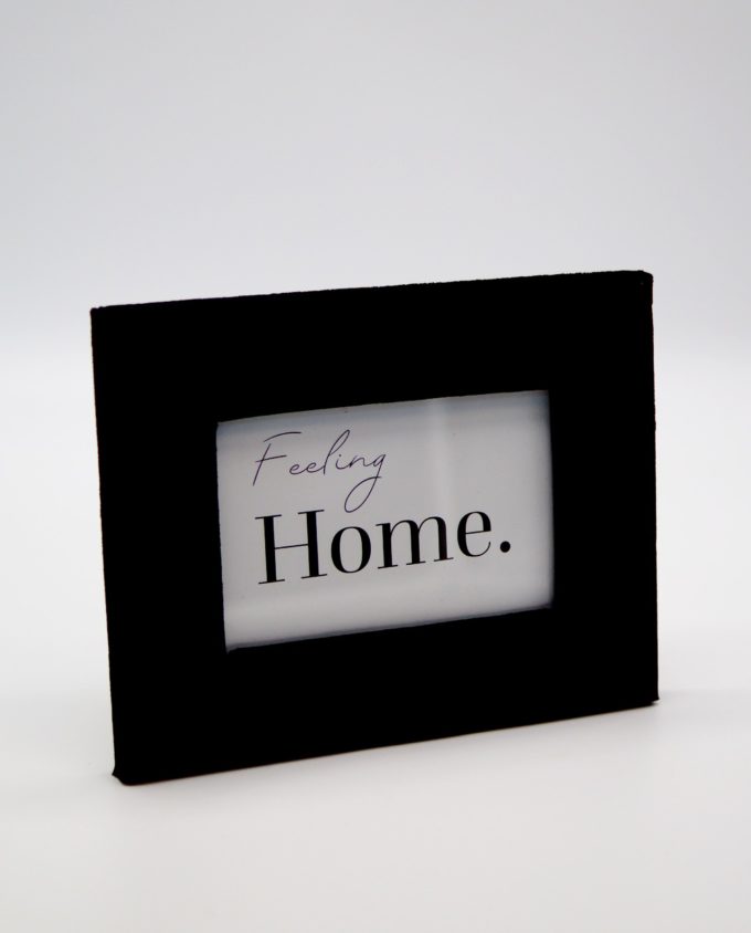 Wooden picture frame with black velvet fabric exterior