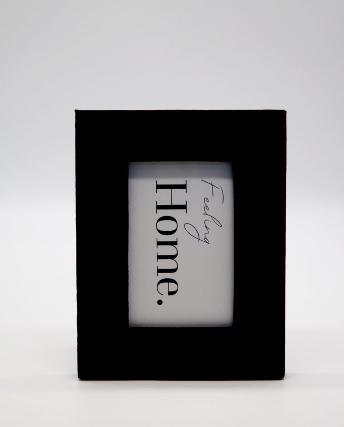 Wooden picture frame with black velvet fabric exterior