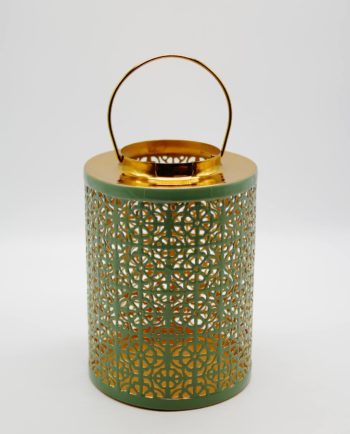 Lantern made of metal in light pastel green color. Dimension: height 26 cm, diameter 19 cm