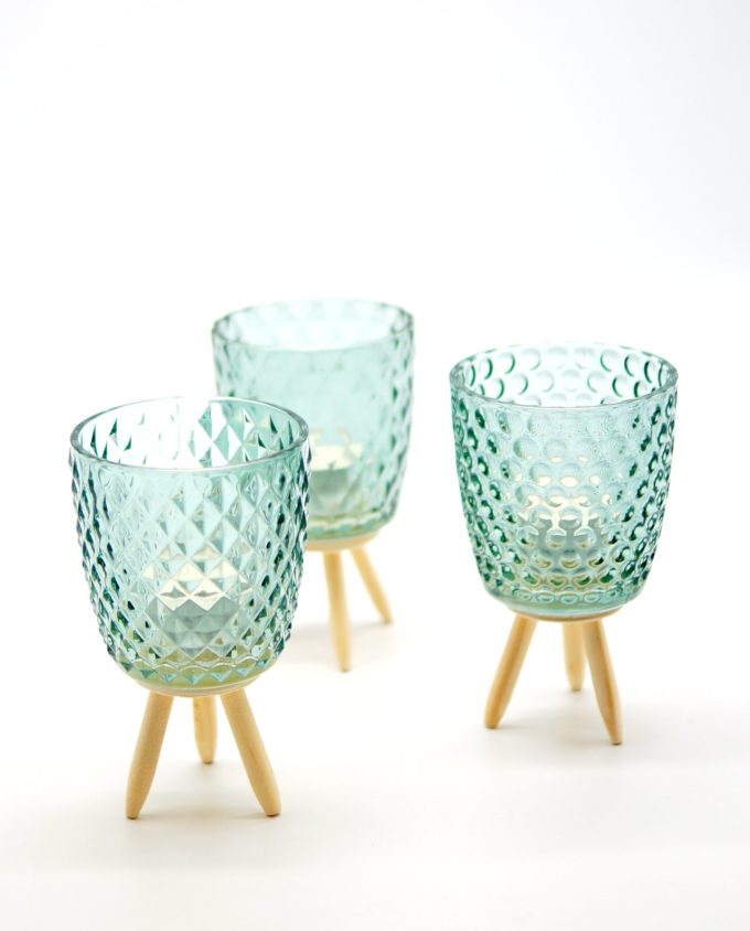 Votives of tealight light green glass with wooden legs